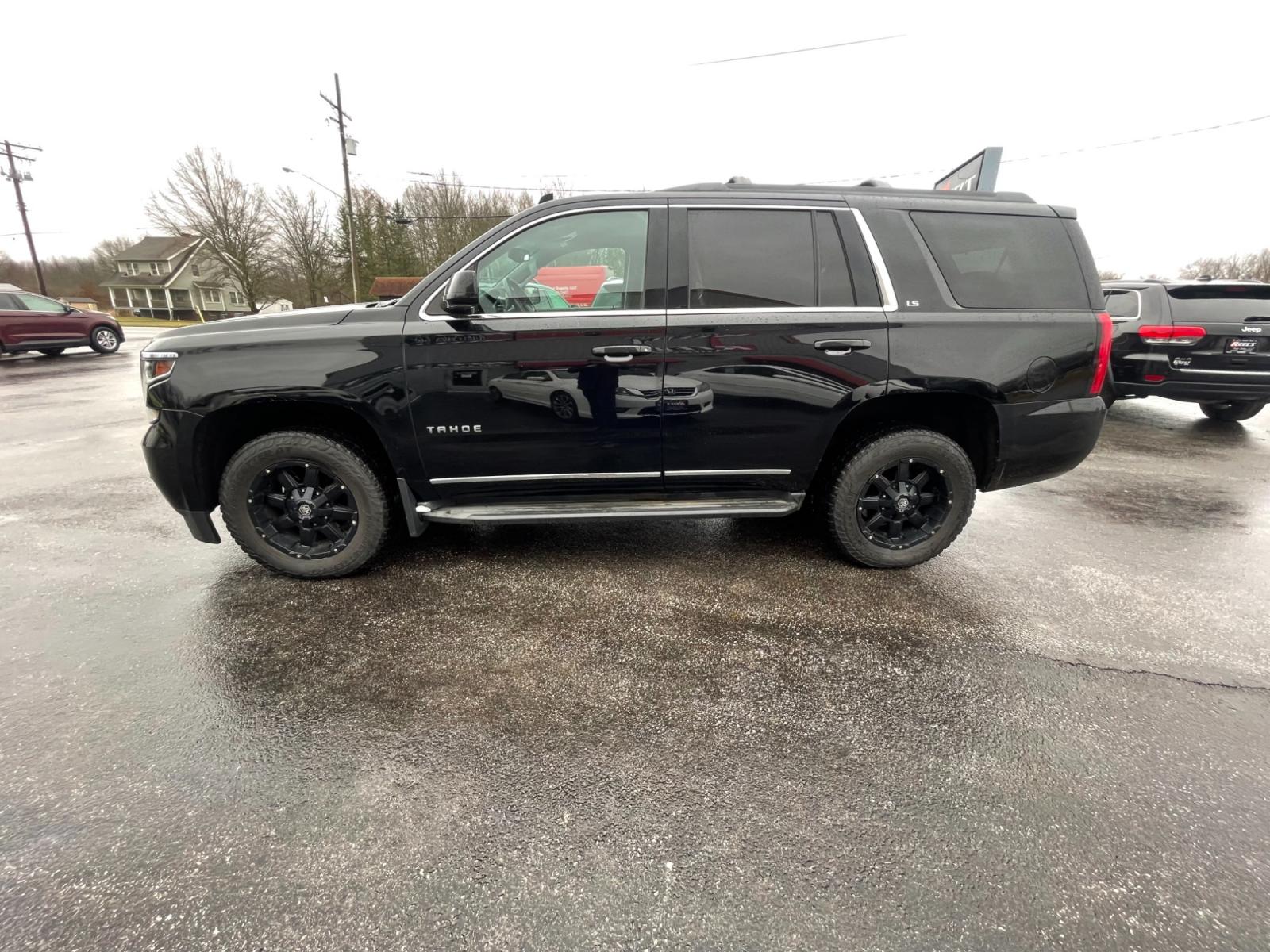 2015 Black /Black Chevrolet Tahoe LS 4WD (1GNSKAEC8FR) with an 5.3L V8 OHV 16V engine, 6-Speed Automatic transmission, located at 547 E. Main St., Orwell, OH, 44076, (440) 437-5893, 41.535435, -80.847855 - This 2015 Chevrolet Tahoe LS 4WD is a versatile and robust full-size SUV that offers a range of comfort and utility features, appealing to families and those needing a capable vehicle for towing and outdoor adventures. Equipped with Tri-Zone Automatic Climate Control, Power Front Seats, and Rain Sen - Photo #15